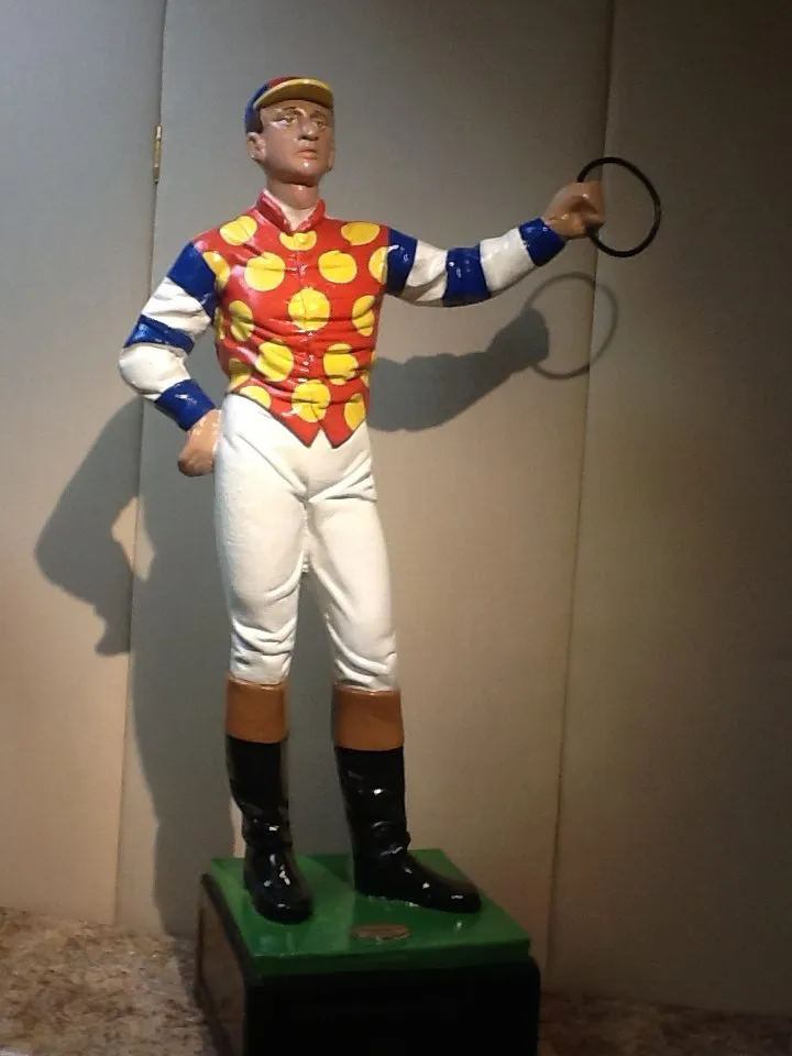 A lawn jockey hand painted by Saratoga Signature
